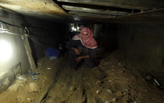 A Palestinian man works inside a smuggling tunnel which connects the Gaza Strip and Egypt in Rafah, southern Gaza Strip, November 24, 2012 (photo credit: Abed Rahim Khatib/Flash90) A Palestinian man works inside a smuggling tunnel which connects the Gaza Strip and Egypt in Rafah, southern Gaza Strip, November 24, 2012 (photo credit: Abed Rahim Khatib/Flash90)