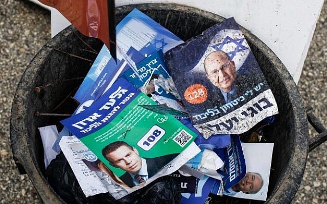 Discarded campaign flyers rest in a trash can following the Likud party primaries on Nov 25, 2012 (photo credit: Uri Lenz/Flash90)