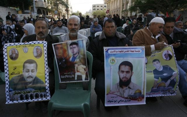 Palestinians rallying in November 2012 for hunger-striking prisoners to be released. (photo credit: Abed Rahim Khatib/Flash90)