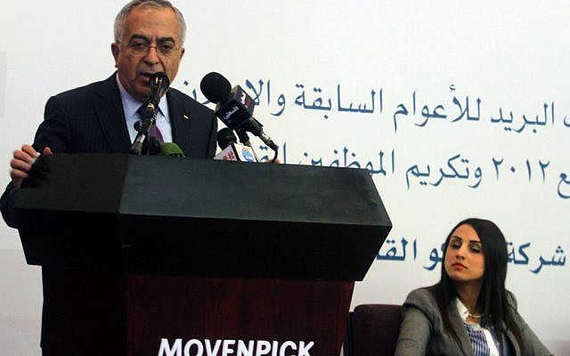 Palestinian prime minister Salam Fayyad participates in the unveiling of the first postage stamp bearing the name of the State of Palestine on January 28, 2013 (photo credit: Issam Rimawi/Flash90)