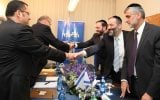 Staying or leaving? Aryeh Deri (with the blue tie) and other Shas leaders meet with Likud to discuss forming a coalition. Deri is reportedly mulling a run for Jerusalem's top office (photo credit: Gideon Markowicz/Flash90)