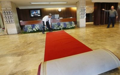 Knesset workers lay out the red carpet for the opening session of the 19th Knesset on February 4 (photo credit: Miriam Alster/Flash90)