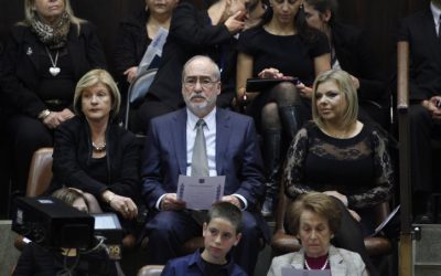Sara Netanyahu (right) sits next to Supreme Court President  Asher Grunis during the during the swearing in ceremony for Israel's 19th Knesset on Tuesday, February 5 (photo credit:  Flash90)