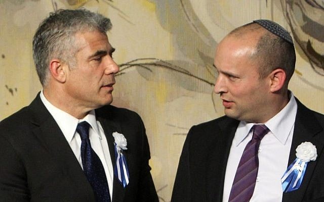 Finance Minister Yair Lapid, left, and Economy Minister Naftali Bennett at the opening session of the Knesset in January, 2013. (Miriam Alster/Flash90) Finance Minister Yair Lapid, left, and Economy Minister Naftali Bennett at the opening session of the Knesset in January, 2013. (Miriam Alster/Flash90)
