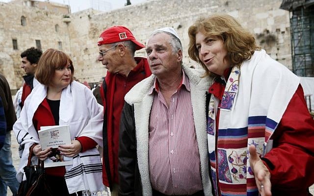 Women of the Wall Anat Hoffman (right) and Lesley Sachs (left), with two paratrooper veterans, shortly before the women were arrested near the Western Wall on Monday (photo credit: Miriam Alster/Flash 90)