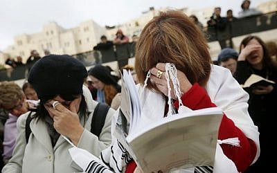 Members of the Women of the Wall wear prayer shawls as they pray at the Western Wall on February 11, 2013. (photo credit: Miriam Alster/Flash90)