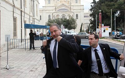 Former foreign minister Avigdor Liberman makes his way to Jerusalem Magistrate's Court Sunday February 17, 2013, to begin his trial on charges of fraud and breach of trust. (photo credit: Yossi Zamir/Flash90)