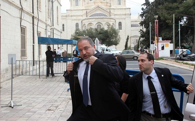Former foreign minister Avigdor Liberman makes his way to Jerusalem Magistrate's Court Sunday February 17, 2013, to begin his trial on charges of fraud and breach of trust. (photo credit: Yossi Zamir/Flash90) Former foreign minister Avigdor Liberman makes his way to Jerusalem Magistrate's Court Sunday February 17, 2013, to begin his trial on charges of fraud and breach of trust. (photo credit: Yossi Zamir/Flash90)