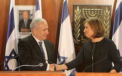 Prime Minister Benjamin Netanyahu and Hatnua party leader Tzipi Livni at the joint press conference where Livni announced she was joining Netanyahu's government as minister of justice, February 19, 2013. (Photo credit: Miriam Alster/FLASH90)