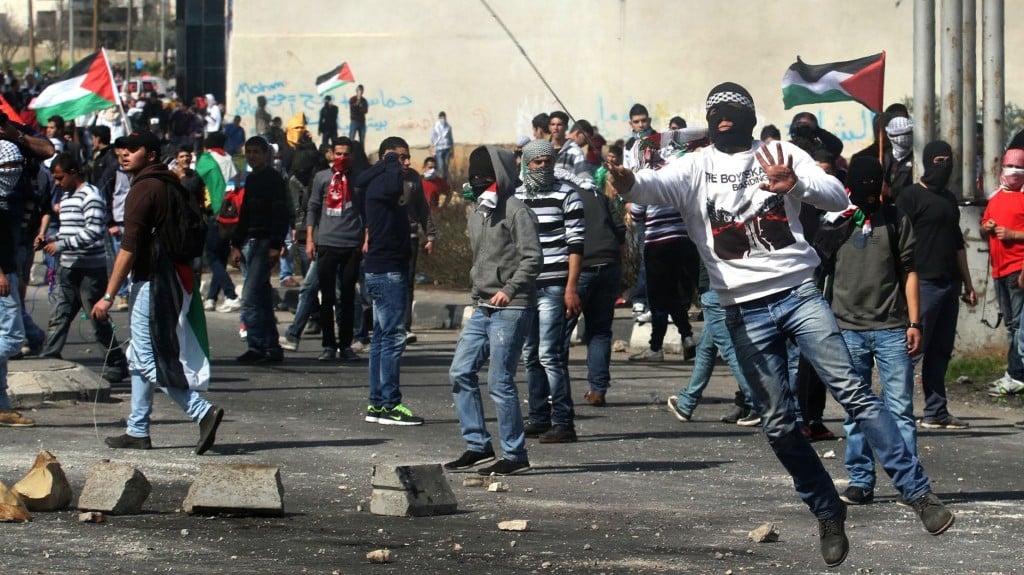 Palestinian protesters hurl rocks at Israeli soldiers during clashes next to Ofer prison, near the West Bank city of Ramallah, on Thursday (photo credit: Issam Rimawi/Flash90) Palestinian protesters hurl rocks at Israeli soldiers during clashes next to Ofer prison, near the West Bank city of Ramallah, on Thursday (photo credit: Issam Rimawi/Flash90)