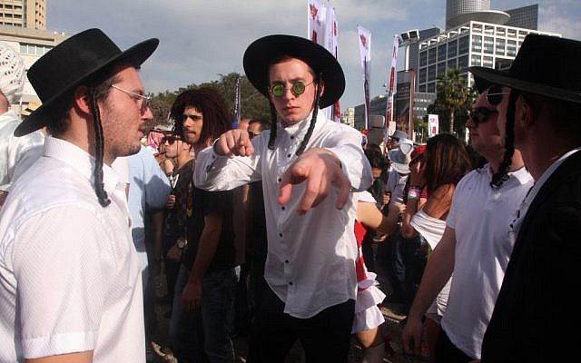 It's all about masks and masquerades; fake 'haredim' in Tel Aviv on Purim (photo credit: Roni Schutzer/Flash 90)