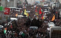 Thousands of Palestinians attend the funeral of Arafat Jaradat in the West Bank village of Si'ir, near Hebron on Monday, February 25 (photo credit: Issam Rimawi/Flash90)