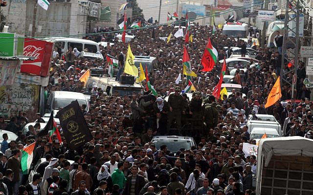 Thousands of Palestinians attend the funeral of Arafat Jaradat in the West Bank village of Si'ir, near Hebron on Monday, February 25 (photo credit: Issam Rimawi/Flash90) Thousands of Palestinians attend the funeral of Arafat Jaradat in the West Bank village of Si'ir, near Hebron on Monday, February 25 (photo credit: Issam Rimawi/Flash90)