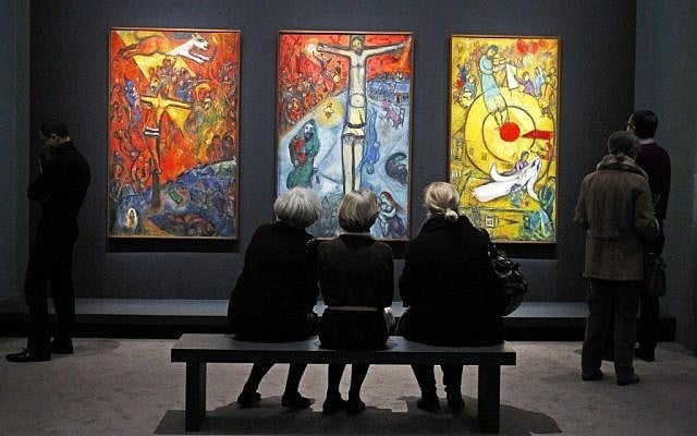 A triptych by Russian artist Marc Chagall at the exhibition: "Chagall, between War and Peace" at the Luxembourg museum in Paris. Paintings are from left: Resistance (1937), Resurrection (1948), and Liberation (1952). (photo credit: Remy de la Mauviniere/AP) A triptych by Russian artist Marc Chagall at the exhibition: "Chagall, between War and Peace" at the Luxembourg museum in Paris. Paintings are from left: Resistance (1937), Resurrection (1948), and Liberation (1952). (photo credit: Remy de la Mauviniere/AP)