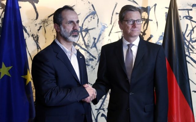 German Foreign Minister Guido Westerwelle, right, and Sheikh Mouaz Al-Khatib, president of the National Coalition of Syrian Revolutionary and Opposition Forces, shake hands during the Security Conference in Munich on Friday. (photo credit: Matthias Schrader/AP) German Foreign Minister Guido Westerwelle, right, and Sheikh Mouaz Al-Khatib, president of the National Coalition of Syrian Revolutionary and Opposition Forces, shake hands during the Security Conference in Munich on Friday. (photo credit: Matthias Schrader/AP)