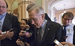 Senate Majority Leader Harry Reid of Nevada makes his way to the Senate floor on Capitol Hill in Washington after a Democratic caucus meeting earlier this month. (photo credit: AP/J. Scott Applewhite)