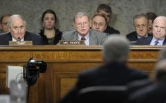 Senate Armed Services Committee ranking member Sen. James Inhofe, R-Okla., center , asks a question of former Nebraska Sen. Chuck Hagel, in foreground, during the Senate Armed Services Committee hearing on his nomination on Thursday. Senate Armed Services Committee Chairman Carl Levin, D-Mich., left, and Sen. John McCain, R-Ariz., right, listen. (photo credit: AP/Susan Walsh)
