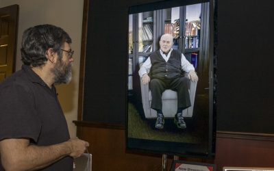 Computer scientist David Traum interacts with the digital doppelganger of Holocaust survivor Pinchus Gutter at the University of Southern California in Los Angeles on Tuesday (photo credit: AP/Damian Dovarganes)