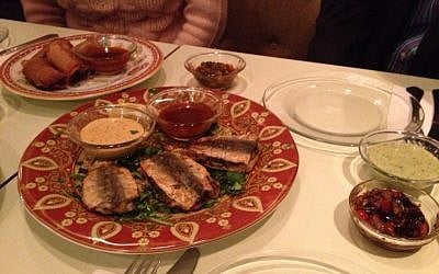 A plate of jujim, or stuffed sardines served with an aioli sauce (photo credit: Jessica Steinberg/Times of Israel)