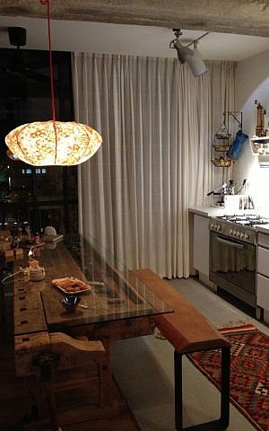 A repurposed carpenter's table lit by Steigman Gavish's first light fixture (photo credit: Jessica Steinberg/Times of Israel) A repurposed carpenter's table lit by Steigman Gavish's first light fixture (photo credit: Jessica Steinberg/Times of Israel)