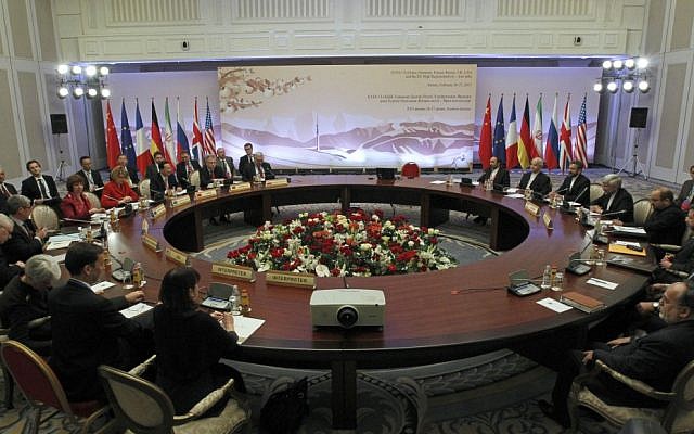 Diplomats participate in the fourth round of high-level talks with an Iranian delegation, right, aimed at stopping the Islamic regime's nuclear program from making atomic weapons in Almaty, Kazakhstan in February. (photo credit: AP/ Shamil Zhumatov, Pool) Diplomats participate in the fourth round of high-level talks with an Iranian delegation, right, aimed at stopping the Islamic regime's nuclear program from making atomic weapons in Almaty, Kazakhstan in February. (photo credit: AP/ Shamil Zhumatov, Pool)
