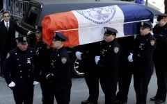 A casket containing the remains of former New York City Mayor Ed Koch is brought into Temple Emanu-El, for his funeral in New York on Monday. (photo credit: AP/Seth Wenig)
