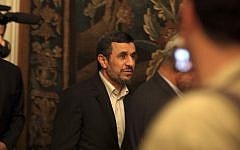 Iran's President Mahmoud Ahmadinejad, leaves a press conference in Cairo, Egypt, Thursday Feb. 7, 2013. (photo credit: AP/Khalil Hamra)