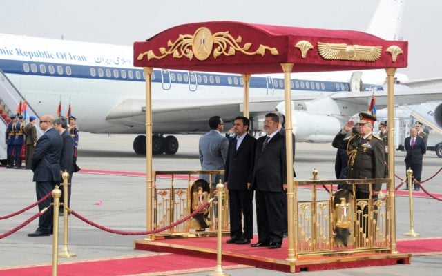 Mohammed Morsi, right, and Mahmoud Ahmainejad at Cairo airport on Tuesday. (photo credit: AP/Egyptian presidency) Mohammed Morsi, right, and Mahmoud Ahmainejad at Cairo airport on Tuesday. (photo credit: AP/Egyptian presidency)