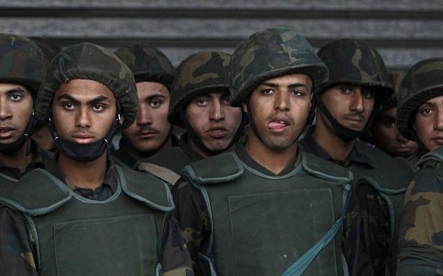 Illustrative photo of Egyptian soldiers standing guard during a demonstration in front of the presidential palace in Cairo, Egypt, in 2012. (photo credit: AP/Petr David Josek)