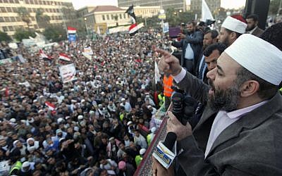 Tarek el-Zomor, a founding member of al-Gamaa al-Islamiyya, speaks to thousands of hard-line Islamist demonstrators in Cairo, Egypt, on Friday (photo credit: AP/Amr Nabil)