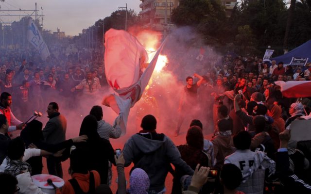Egyptian protesters shout anti-Mohammed Morsi slogans before clashes in front of the presidential palace in Cairo, Egypt, Friday. (AP Photo/Amr Nabil)