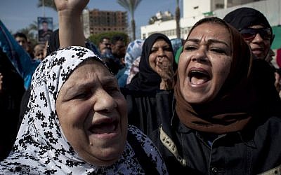 Female protesters chant anti-President Mohammed Morsi slogans in Port Said, Egypt, (photo credit: AP/Nasser Nasser)