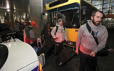 US freestyle wrestling team members arrive at the Imam Khomeini airport in Tehran, Iran, on February 19, 2013, to attend the World Cup tournament. (photo credit: Vahid Salemi/AP) US freestyle wrestling team members arrive at the Imam Khomeini airport in Tehran, Iran, on February 19, 2013, to attend the World Cup tournament. (photo credit: Vahid Salemi/AP)
