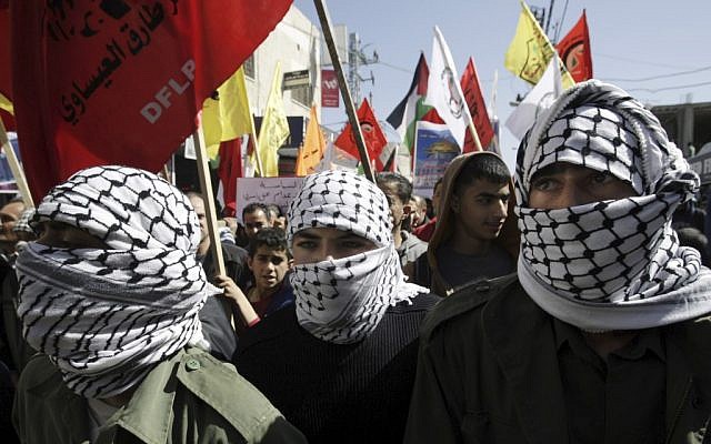 People in Jenin march in support of Palestinian prisoners, February 26, 2013 (photo credit: Mohammed Ballas/AP) People in Jenin march in support of Palestinian prisoners, February 26, 2013 (photo credit: Mohammed Ballas/AP)