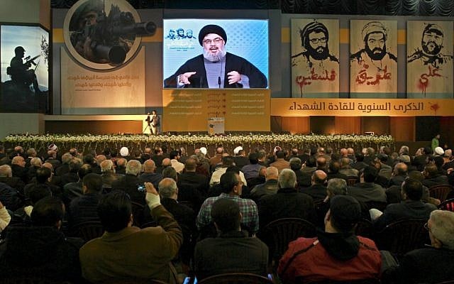 Hezbollah leader Sheik Hassan Nasrallah speaks via a video link during a ceremony to mark the anniversary of the death of Hezbollah leaders, in the southern suburbs of Beirut, Lebanon, Saturday, Feb. 16, 2013 (photo credit: AP/Bilal Hussein) Hezbollah leader Sheik Hassan Nasrallah speaks via a video link during a ceremony to mark the anniversary of the death of Hezbollah leaders, in the southern suburbs of Beirut, Lebanon, Saturday, Feb. 16, 2013 (photo credit: AP/Bilal Hussein)