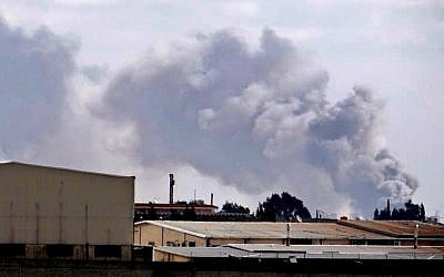 Smoke rises from the Aleppo International Airport earlier this month (photo credit: AP/Aleppo Media Center AMC)