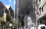 This image taken from video obtained from Bambuser, which has been authenticated based on its contents and other AP reporting, shows smoke and fire after a fighter jet crashed into a suburb of Damascus, Syria, Wednesday, Feb. 20, 2013. (Photo credit: AP/Bambusa)