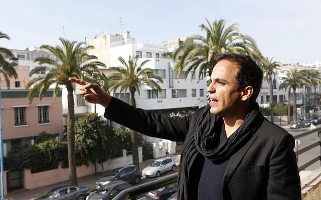 Kamal Hachkar, director of the documentary 'Tinghir to Jerusalem' gestures from a balcony in Casablanca, Morocco, on Friday, February 15, 2013. (photo credit: AP Photo/Abdeljalil Bounhar) Kamal Hachkar, director of the documentary 'Tinghir to Jerusalem' gestures from a balcony in Casablanca, Morocco, on Friday, February 15, 2013. (photo credit: AP Photo/Abdeljalil Bounhar)