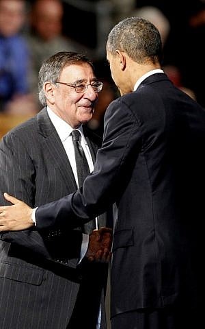 US President Barack Obama embraces outgoing Defense Secretary Leon Panetta during an Armed Forces Farewell Ceremony to honor Panetta, Friday at Joint Base Myer-Henderson Hall in Arlington, Va. (photo credit: AP Photo/Ann Heisenfelt)