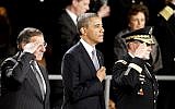US President Barack Obama attends an Armed Forces Farewell Ceremony to honor outgoing Defense Secretary Leon Panetta, left, in February 2013, at Joint Base Myer-Henderson Hall in Arlington, Va. Joint Chiefs Chairman Army Gen. Martin Dempsey is at right. (photo credit: AP Photo/Ann Heisenfelt)