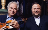 Israeli-born violinist Itzhak Perlman, left, will perform with Manhattan Cantor Yitzchak Meir Helfgot at Brooklyn's Barclays Center on Feb. 28. (Lisa-Marie Mazzucco via JTA)