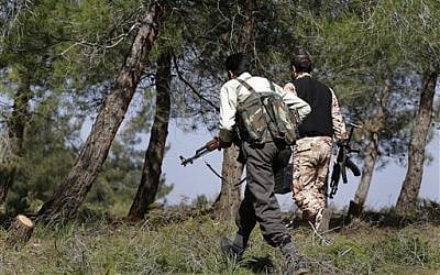 Free Syrian Army fighters at Jabal al-Zaweya, in Idlib province, Syria. February 27, 2013 (photo credit: AP Photo/Hussein Malla)
