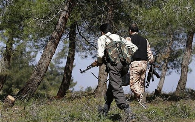 Free Syrian Army fighters at Jabal al-Zaweya, in Idlib province, Syria. February 27, 2013 (photo credit: AP Photo/Hussein Malla) Free Syrian Army fighters at Jabal al-Zaweya, in Idlib province, Syria. February 27, 2013 (photo credit: AP Photo/Hussein Malla)