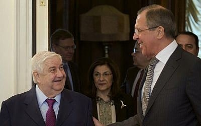 Russian Foreign Minister Sergey Lavrov (right), welcomes Syrian Foreign Minister Walid Moallem (left), in Moscow, February 25, 2013. (AP/Ivan Sekretarev)