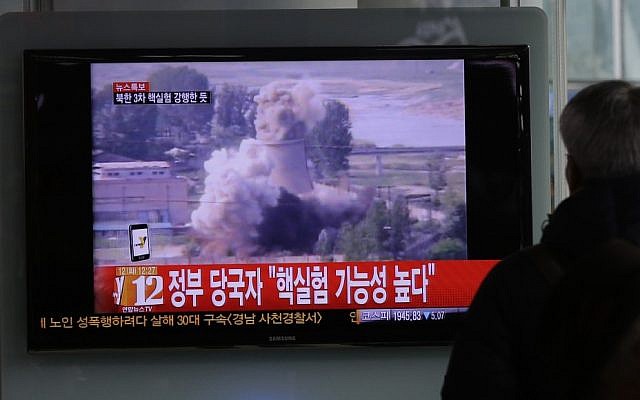 A South Korean man watches TV news showing file footage of North Korea's nuclear test at the Seoul train station in Seoul, South Korea, Tuesday, Feb. 12 (photo credit: AP /Lee Jin-man)