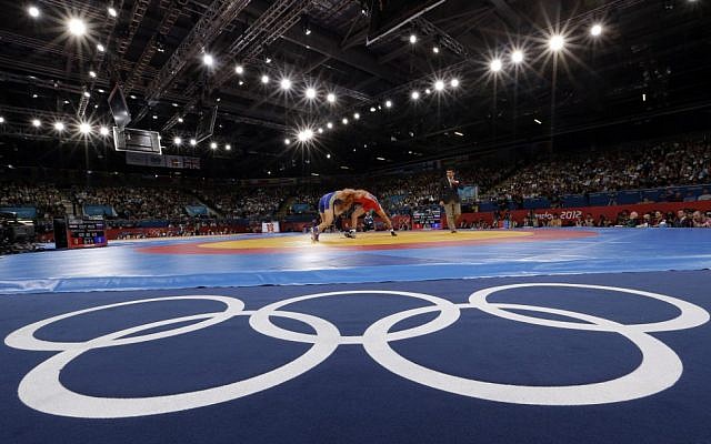 FILE - The Aug. 6, 2012 file photo shows Sayed Abdelmonem Hamed of Egypt competing against Zaur Kuramagomedov of Russia (in blue) during the 60-kg Greco-Roman wrestling competition at the 2012 Summer Olympics in London (AP Photo/Paul Sancya) FILE - The Aug. 6, 2012 file photo shows Sayed Abdelmonem Hamed of Egypt competing against Zaur Kuramagomedov of Russia (in blue) during the 60-kg Greco-Roman wrestling competition at the 2012 Summer Olympics in London (AP Photo/Paul Sancya)