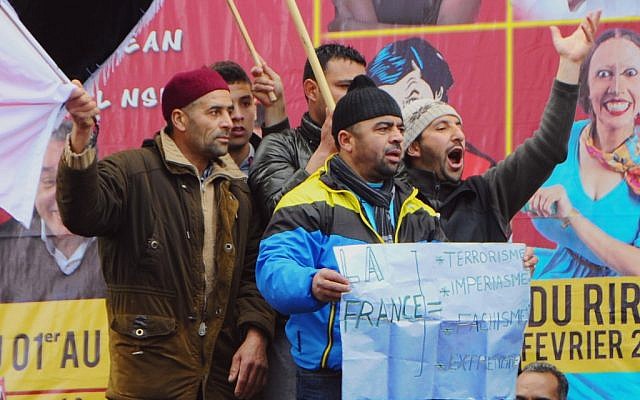 Activists of the Islamic Party Ennahda wave flags and banners during a demonstration in Tunis Saturday Feb 9, 2013 (photo credit: AP/Hassene Dridi) Activists of the Islamic Party Ennahda wave flags and banners during a demonstration in Tunis Saturday Feb 9, 2013 (photo credit: AP/Hassene Dridi)