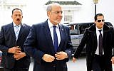 Tunisian Prime Minister Hamadi Jebali, center, arrives for meeting with political parties in an effort to end a crisis exacerbated by a political assassination two weeks ago, outside Tunis, Monday, Feb. 18 (photo credit: AP/Hassene Dridi)