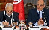 Tunisian Prime Minister Hamadi Jebali, right, is pictured with Ennahda party leader Rached El Ghannouchi at the opening of a meeting with representatives of Tunisian political parties in Carthage, outside Tunis, in February 2013. (photo credit: AP/Hassene Dridi)