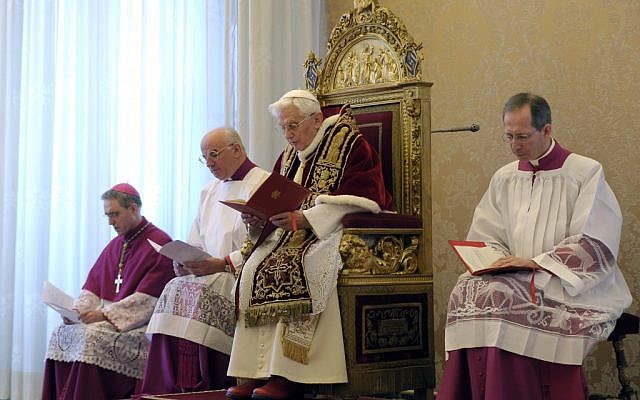 Pope Benedict XVI, third from left, delivers his message at the end of a meeting of Vatican cardinals, at the Vatican, Monday, Feb. 11, 2013. From left are Archbishop Georg Gaenswein, Mons. Franco Camaldo, and Mons. Guido Marini, pope aides. (photo credti: AP/L'Osservatore Romano) Pope Benedict XVI, third from left, delivers his message at the end of a meeting of Vatican cardinals, at the Vatican, Monday, Feb. 11, 2013. From left are Archbishop Georg Gaenswein, Mons. Franco Camaldo, and Mons. Guido Marini, pope aides. (photo credti: AP/L'Osservatore Romano)